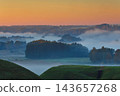 Fields covered in fog in Kernave, Lithuania 143657268