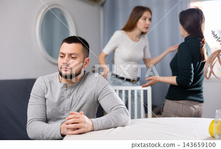Man waiting for two women stop quarreling Man waiting for two women stop quarreling 143659100