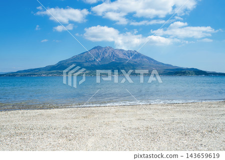 The white sandy beach of Iso Beach in summer, the blue Kinko Bay, and the scenery of Sakurajima volcano. The white sandy beach of Iso Beach in summer, the blue Kinko Bay, and the scenery of Sakurajima volcano. 143659619