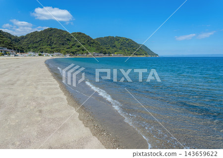 The white sandy beach of Iso Beach in summer and the vast, blue landscape of Kinko Bay. The white sandy beach of Iso Beach in summer and the vast, blue landscape of Kinko Bay. 143659622