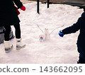 A snowman and a child in Shirakawa-go 143662095