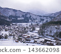 The village of Shirakawa-go and the snow-covered mountains 143662098