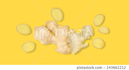 Ginger root and slices display naturally on bright yellow background Ginger root and slices display naturally on bright yellow background 143662212