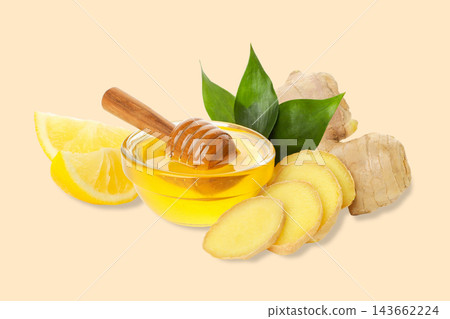 Ginger slices are arranged next to honey and lemon. Wellness and natural remedy concept 143662224