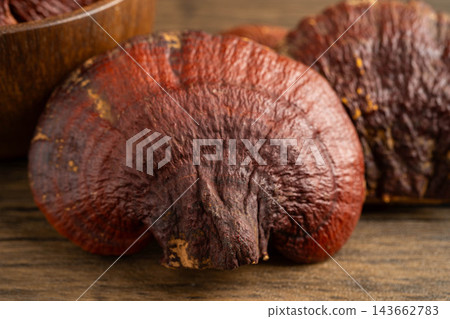 Dried lingzhi mushroom with capsule drug, alternative medicine herbal organic herb. Dried lingzhi mushroom with capsule drug, alternative medicine herbal organic herb. 143662783