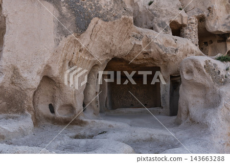 Historic rock-cut cave dwellings at Uchisar Castle in Cappadocia, Turkey Historic rock-cut cave dwellings at Uchisar Castle in Cappadocia, Turkey 143663288