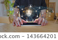 VPN global privacy and security stock photo with digital overlay of shield and connected user icons 143664201