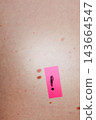 Close-up of skin with scattered moles and freckles beside a pink sticker marked with a hand drawn exclamation point. Mole mapping and skin self-examination support early melanoma detection. 143664547