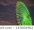 Illuminated Green Rinku no Hoshi Ferris Wheel at Night in Rinku Town, Osaka, Japan. 143664962