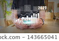 Future data trends conceptual stock photo with digital overlay of bar and line graph above smartphone 143665041