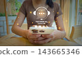 Technical support conceptual stock photo with digital overlay of headset icon and communication methods 143665346