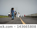 preschool child girl walking on a road on mountain in the morning 143665808