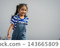 preschool child girl walking on a road on mountain in morning 143665809
