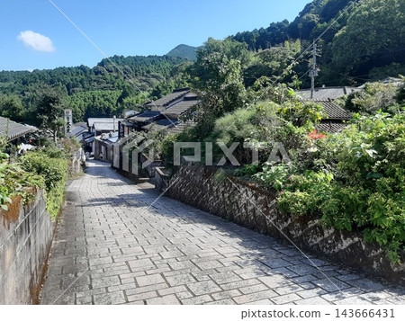 A landscape with slopes; a cobblestone path; a road. A landscape with slopes; a cobblestone path; a road. 143666431