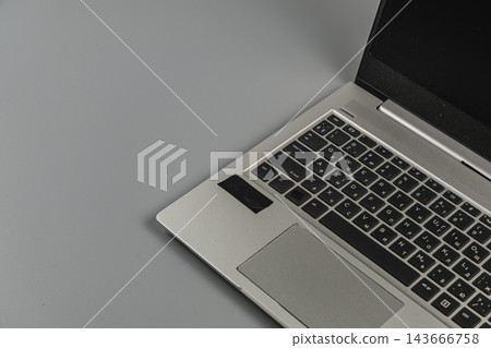 Laptop placed on a gray surface in an office setting Laptop placed on a gray surface in an office setting 143666758