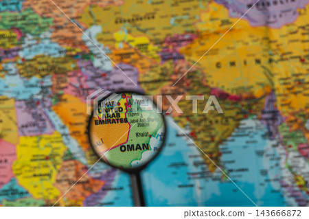 Exploring the map with a magnifying glass to find destinations 143666872