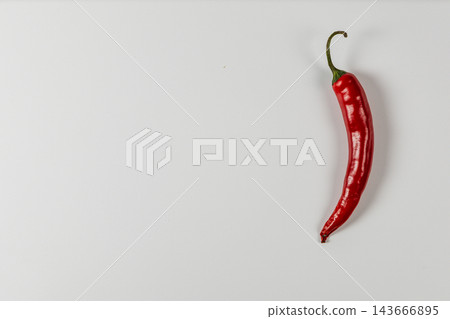 Red chili pepper isolated on a white background Red chili pepper isolated on a white background 143666895