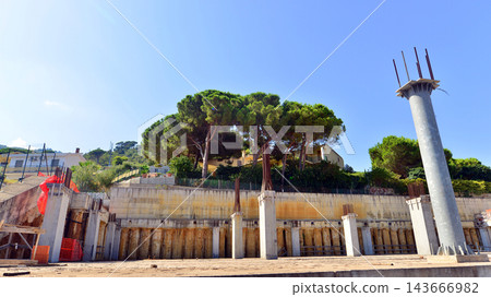 Cefalu, Italy. 21 August 2026. Abandoned commercial building construction site in northern Sicily. Cefalu, Italy. 21 August 2026. Abandoned commercial building construction site in northern Sicily. 143666982