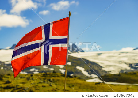Norwegian flag and mountains snowy landscape Norwegian flag and mountains snowy landscape 143667045