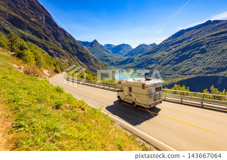 Geiranger fjord and camper on road, Norway. Geiranger fjord and camper on road, Norway. 143667064