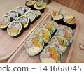 [Korean Food] Kimbap (Korean-style seaweed roll) - packed with ingredients and vibrant in color. 143668045