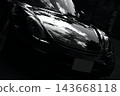 A gleaming black Porsche Boxster Spyder 143668118