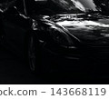 A gleaming black Porsche Boxster Spyder 143668119