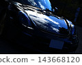 A gleaming black Porsche Boxster Spyder 143668120