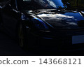 A gleaming black Porsche Boxster Spyder 143668121