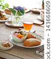 Lunch consisted of homemade cream buns, pain au lait, and scones. 143668609