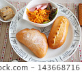Lunch consisted of homemade cream buns, pain au lait, and scones. 143668716
