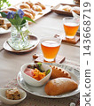 Lunch consisted of homemade cream buns, pain au lait, and scones. 143668719