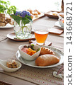 Lunch consisted of homemade cream buns, pain au lait, and scones. 143668721