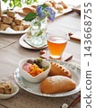 Lunch consisted of homemade cream buns, pain au lait, and scones. 143668755