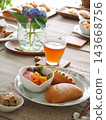 Lunch consisted of homemade cream buns, pain au lait, and scones. 143668756