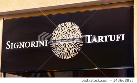 Cefalu, Italy. 21 August 2026. Urban landscape. Neon sign with the inscription: Signorini Tartufi. Cefalu, Italy. 21 August 2026. Urban landscape. Neon sign with the inscription: Signorini Tartufi. 143668955