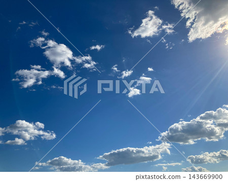 Blue sky with clouds and sunshine Blue sky with clouds and sunshine 143669900