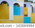 Colorful mediterranean architecture arches and textured walls pattern 143669984