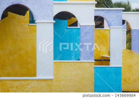 Colorful mediterranean architecture arches and textured walls pattern Colorful mediterranean architecture arches and textured walls pattern 143669984