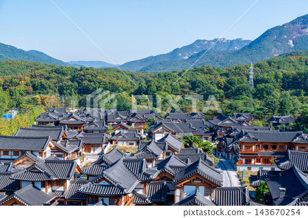 Traditional Korean Hanok Houses and Tiled Roofs against Bukhansan Mountain in Eunpyeong Hanok Village, Seoul Traditional Korean Hanok Houses and Tiled Roofs against Bukhansan Mountain in Eunpyeong Hanok Village, Seoul 143670254