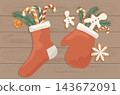 Flat lay Christmas stocking and mitten with gifts on wooden table. Cozy eco winter holiday present sock and woolen gloves vector banner background 143672091