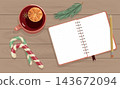 Flat lay Christmas notepad with pencil and mulled wine mug on wooden table. Cozy eco winter corporate workspace background with empty copy space 143672094