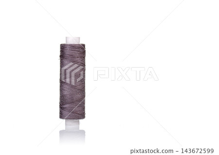 skein of gray thread macro on a white background skein of gray thread macro on a white background 143672599