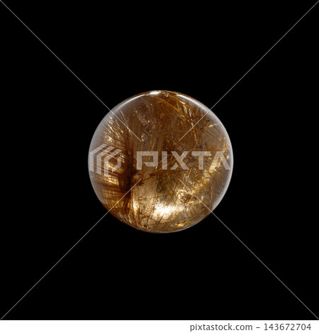 Ball of quartz with rutile on a black background 143672704