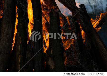 Beautiful fire flames on a campfire Beautiful fire flames on a campfire 143672705