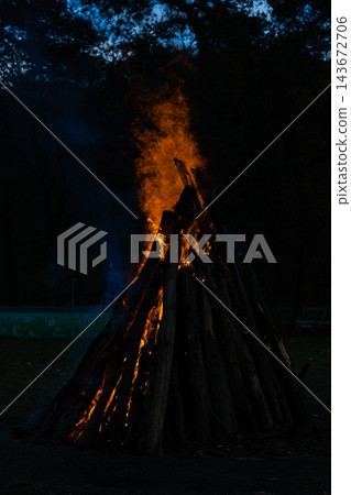 Beautiful fire flames on a campfire Beautiful fire flames on a campfire 143672706