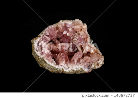Macro mineral stone Pink Amethyst on a black background 143672737