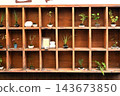Pots displayed on a shelf 143673850