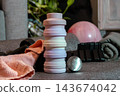 Essential items for exercising at home: a yoga mat, ankle weights, a water bottle, all ready for a mindful workout that promotes well-being and a daily exercise routine. 143674042