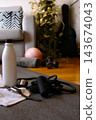 Fitness equipment on a yoga mat in a home setting, symbolizing personal wellness journey and at-home workout routines for health and active living 143674043
